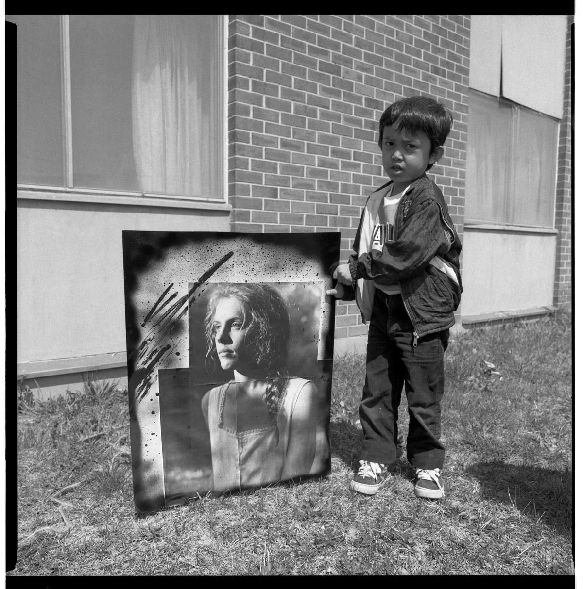 Boy Holding Photomontage I Did of Carol During My Light Work Artist's Residency, Syracuse, New York, 1989 by John Hodges
